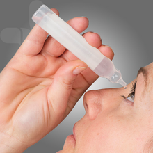 Load image into Gallery viewer, Person administering eye drops.
